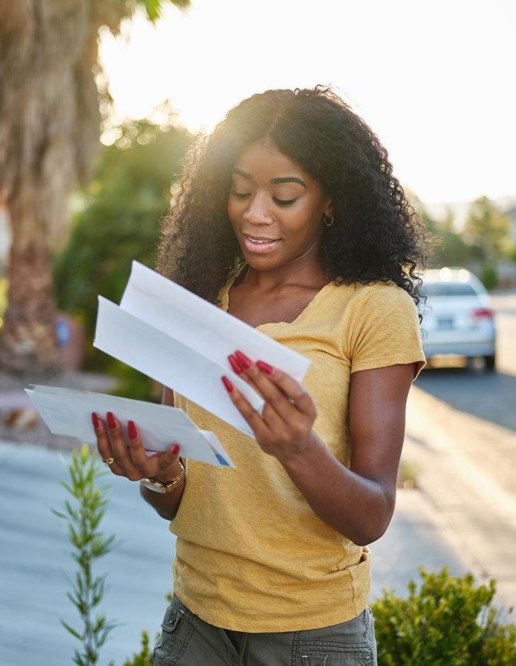 a student looks through her recieved mail